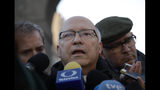 Bishop Fernando Ramos, Secretary General Episcopal Conference of Chile, receives media attention near the Vatican, in Rome Monday, Jan. 14, 2019. A delegation of Chilean bishops has met with Pope Francis a year after he threw his papacy into turmoil by defending a Chilean bishop accused of covering for a notorious sexual predator. (AP Photo/Alessandra Tarantino)