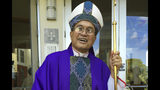 FILE - In this Nov. 30, 2014 file photo, Archbishop Anthony Apuron stands in front of the Dulce Nombre de Maria Cathedral Basilica in Hagatna, Guam. On Thursday, April 4, 2019 the Vatican upheld its conviction of Guam's ousted archbishop Apuron for sexually abusing minors and has added a further penalty on appeal that effectively prevents him from presenting himself as a bishop. (AP Photo/Grace Garces Bordallo, File)