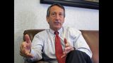 FILE - In this Dec. 18, 2013, file photo, U.S. Rep. Mark Sanford, R-S.C., discusses his first months back in Congress during an interview in Mount Pleasant, S.C. Sanford said Tuesday, July 16, 2019 he's pondering a 2020 primary challenge to President Donald Trump, but political observers - and those who know the former governor and congressman well - say it's nothing more than an attempt to keep himself relevant in the wake of his first-ever electoral loss last year. (AP Photo/Bruce Smith, File)